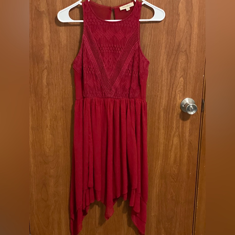 Beautiful sleeveless red dress with lacey detailing.